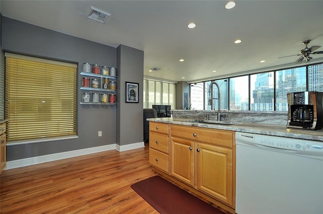 kitchen featuring dishwasher, ceiling fan, sink, and light hardwood / wood-style floors