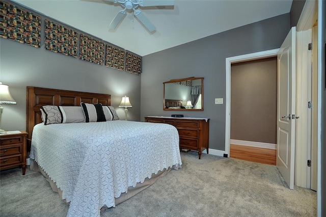 bedroom featuring light colored carpet and ceiling fan