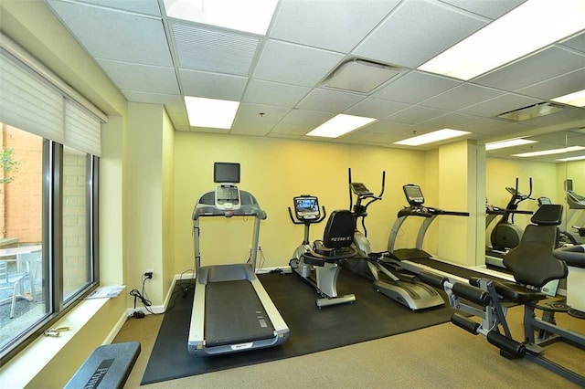 exercise room with a paneled ceiling