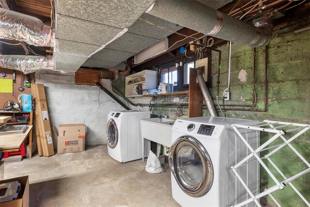 laundry room featuring independent washer and dryer and sink