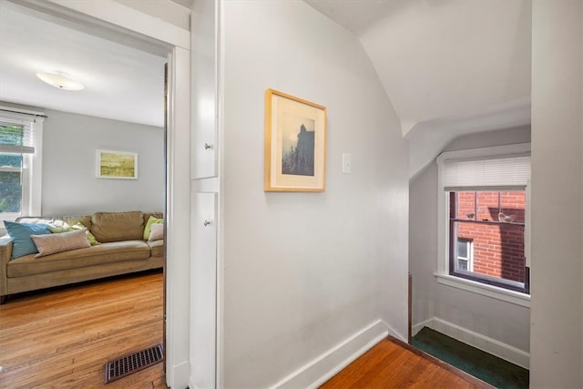 hallway with wood-type flooring