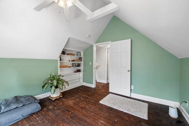 bonus room featuring vaulted ceiling, dark hardwood / wood-style flooring, and ceiling fan