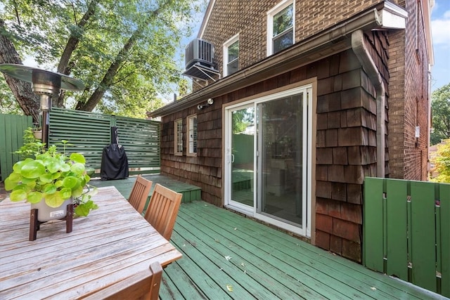 wooden terrace featuring central AC unit