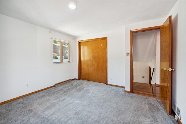 unfurnished bedroom with a closet and carpet floors