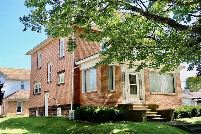 exterior space featuring central AC unit