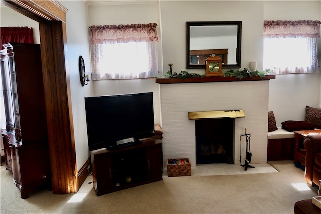 living room featuring a fireplace, plenty of natural light, and carpet floors