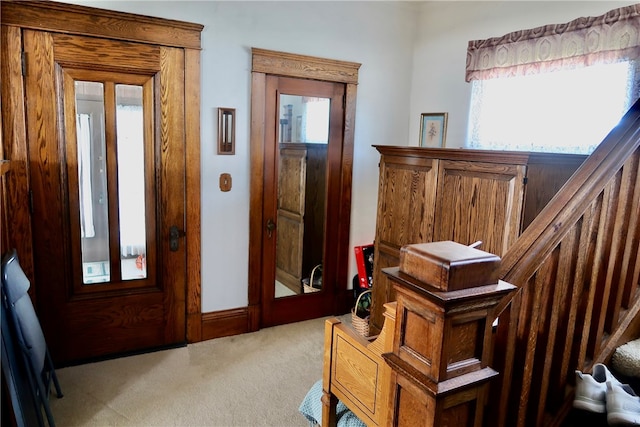 view of carpeted foyer