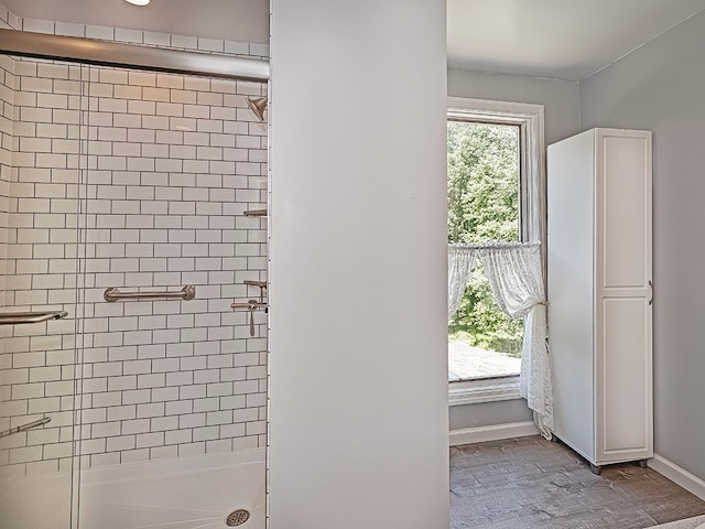 bathroom featuring an enclosed shower