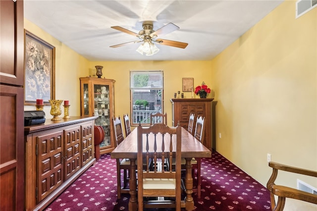 dining area with carpet floors and ceiling fan