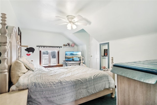 bedroom featuring carpet floors, vaulted ceiling, and ceiling fan