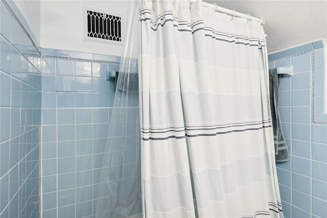 bathroom with a shower with curtain