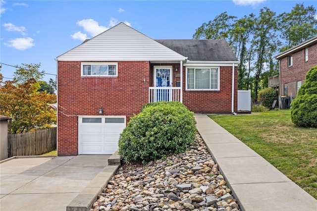 view of front of property with a garage and a front yard