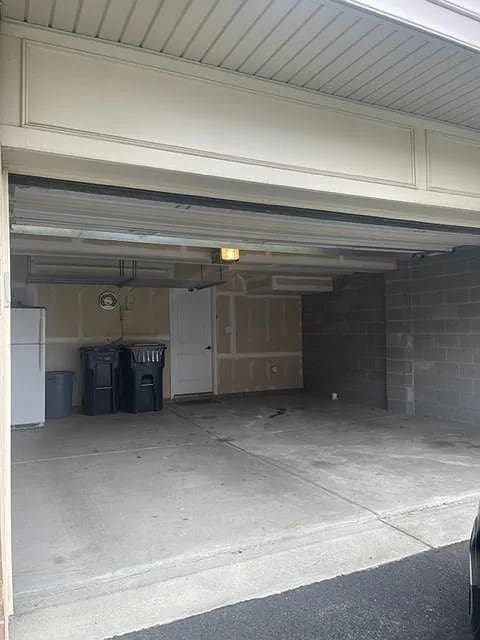 garage with white fridge