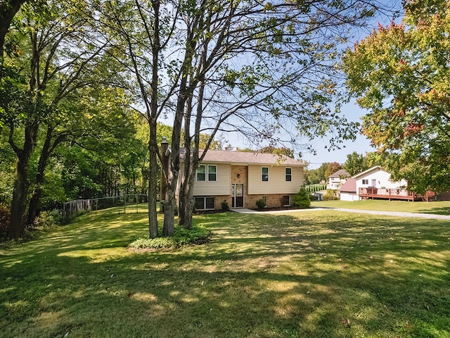 raised ranch featuring a front yard