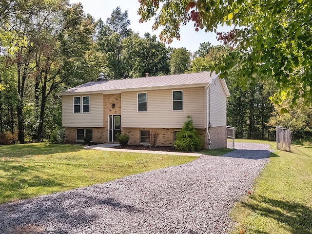 raised ranch with a front lawn