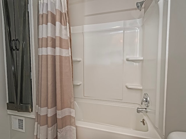 bathroom featuring shower / bath combination with curtain