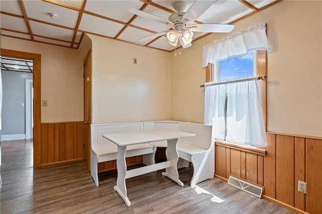 unfurnished dining area featuring wood-type flooring and ceiling fan