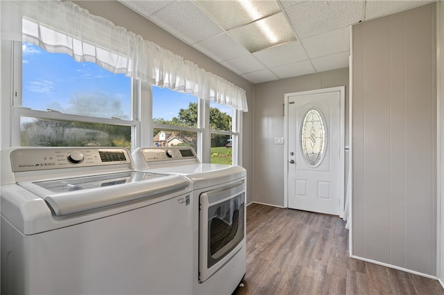 washroom with independent washer and dryer and hardwood / wood-style floors