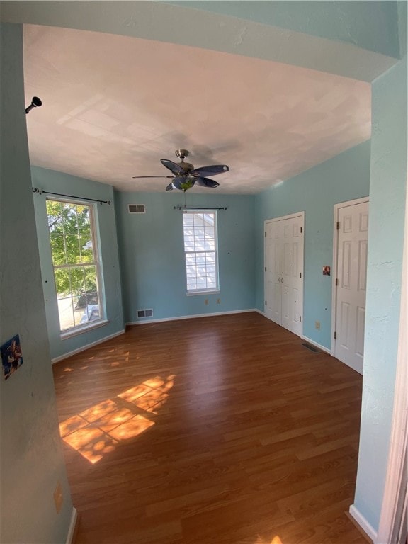 unfurnished room featuring ceiling fan and hardwood / wood-style floors