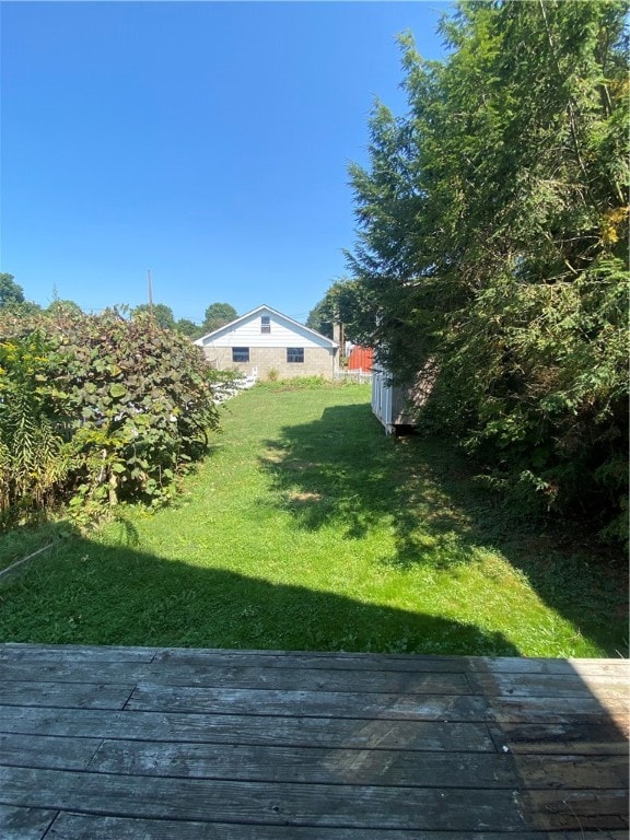 view of yard with a wooden deck