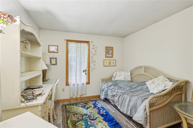 bedroom featuring hardwood / wood-style flooring