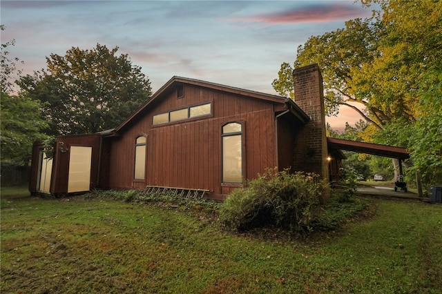 outdoor structure at dusk with a yard