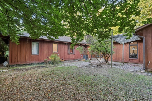 view of yard with central AC unit and a patio area