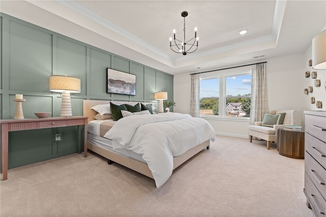 carpeted bedroom with a raised ceiling and a chandelier