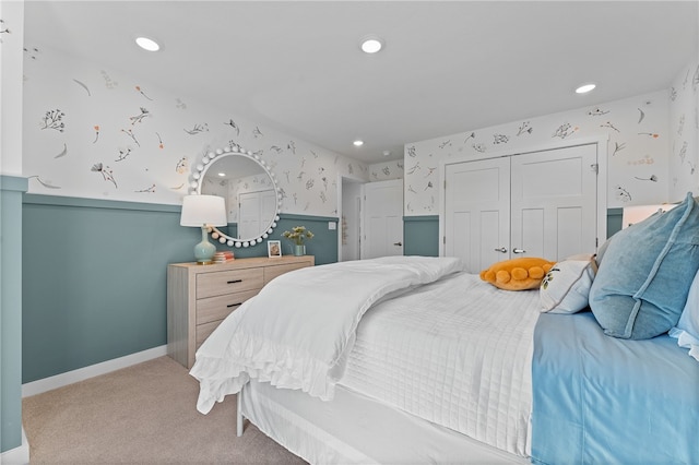 carpeted bedroom featuring a closet