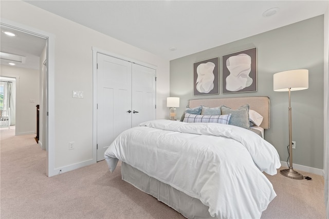 carpeted bedroom with a closet