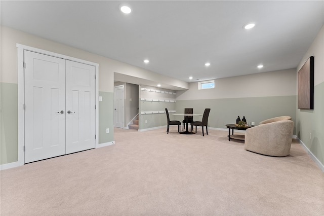 living area featuring light colored carpet