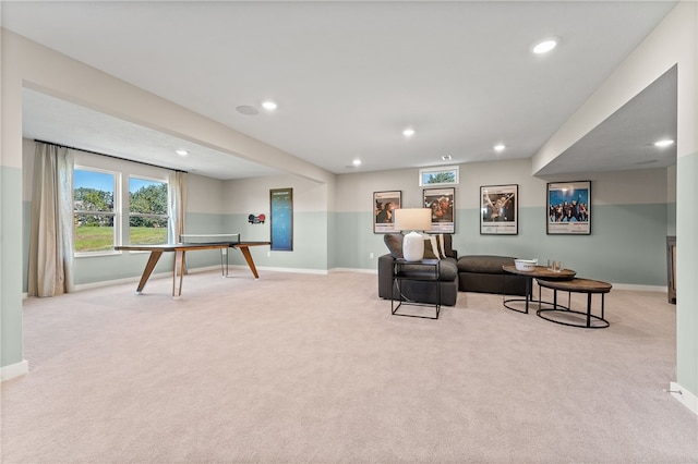 living area with light colored carpet