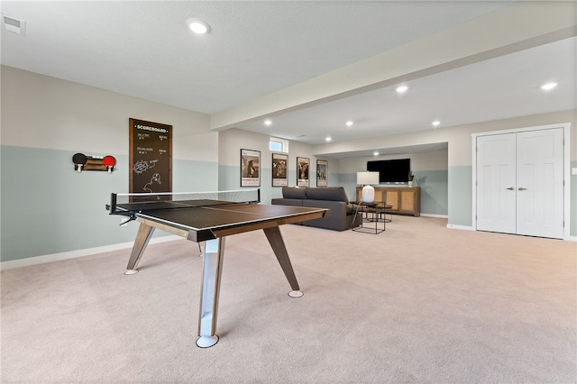 recreation room with light carpet