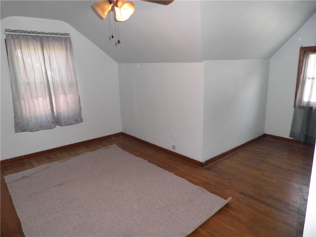 additional living space featuring ceiling fan, dark hardwood / wood-style floors, and vaulted ceiling