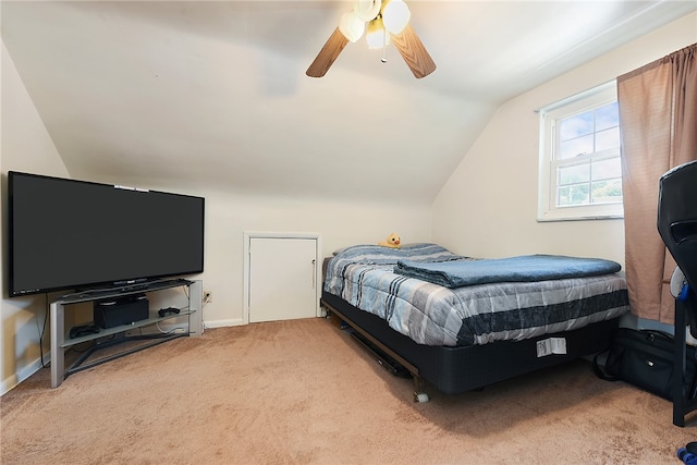 bedroom featuring light carpet, lofted ceiling, and ceiling fan