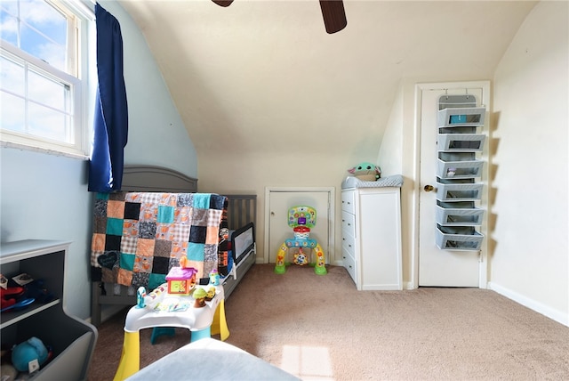 recreation room with ceiling fan, vaulted ceiling, and carpet floors