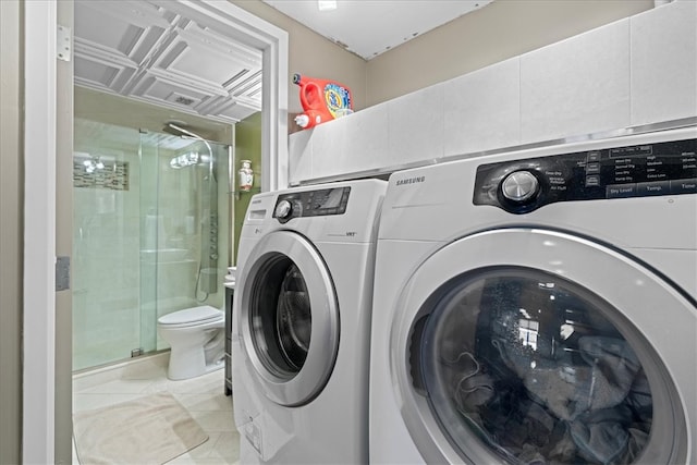 washroom with washing machine and dryer