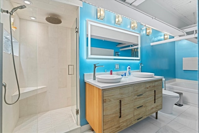 full bathroom featuring vanity, toilet, and shower with separate bathtub