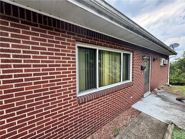 view of side of home featuring a patio