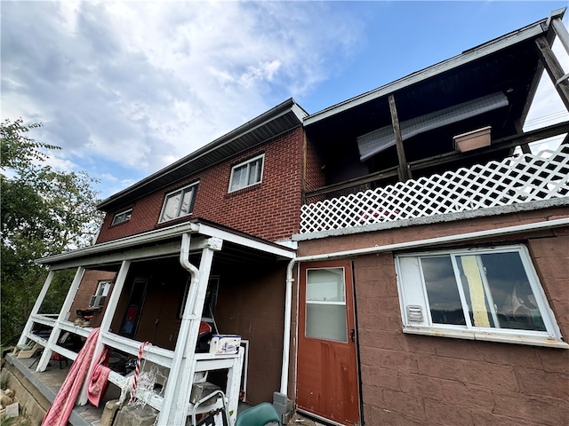 back of property featuring a balcony