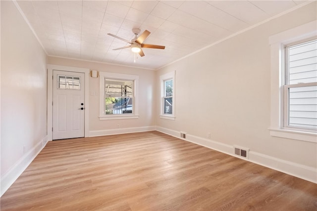 entryway featuring light wood-type flooring, crown molding, and ceiling fan