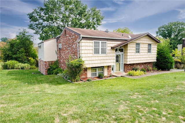 split foyer home with a front lawn