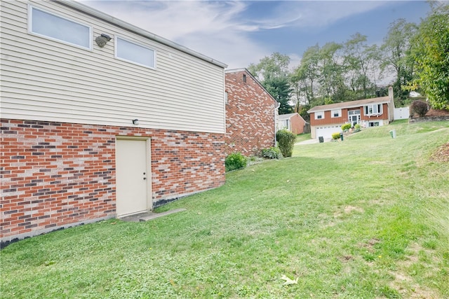 view of yard featuring a garage