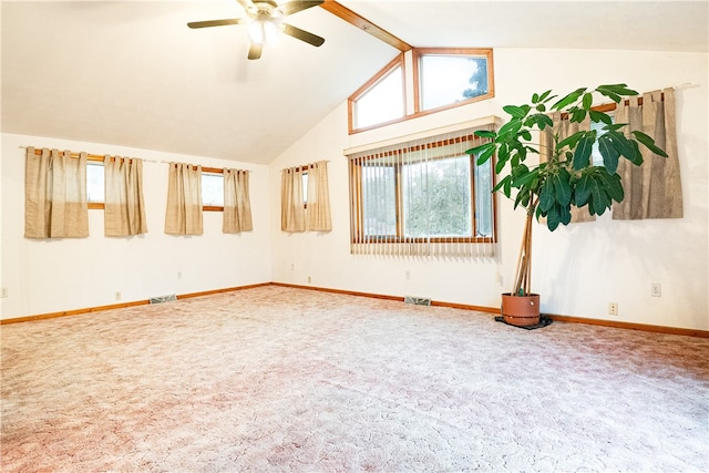 empty room featuring carpet floors, beamed ceiling, and ceiling fan