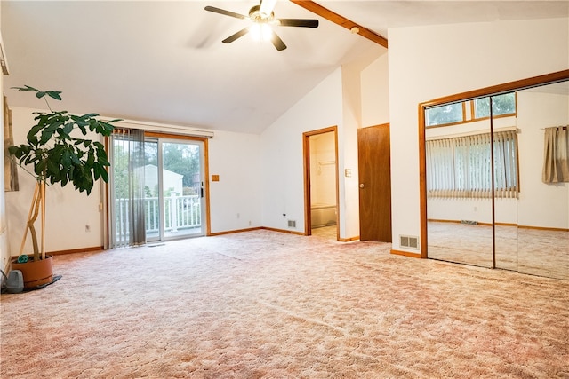 unfurnished bedroom with access to outside, ceiling fan, beamed ceiling, carpet, and high vaulted ceiling