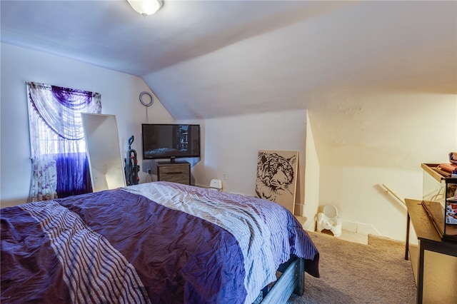 bedroom featuring vaulted ceiling and carpet floors