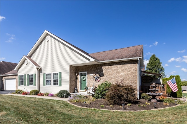 view of front of property featuring a garage and a front yard