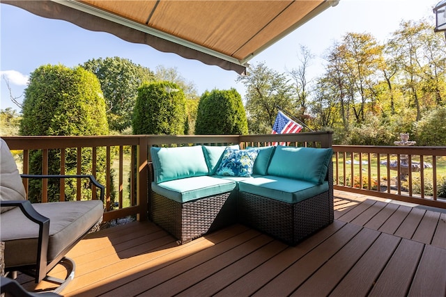 wooden terrace featuring outdoor lounge area