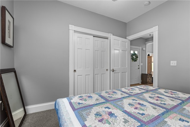 carpeted bedroom with a closet