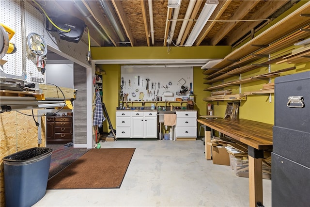 basement featuring a workshop area and sink